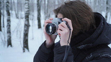 Man taking photo on vintage film camera
