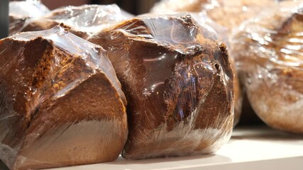 Freshly baked bread on display in bakery shop