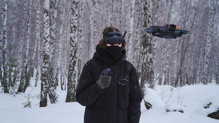 FPV drone operator, close-up, face with glasses
