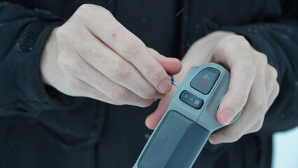 FPV drone operator, close-up, face with glasses