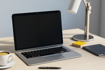 Modern workspace with laptop, coffee cup, lamp, and notebook on light wooden desk in natural lighting environment. 3D Rendering