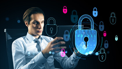 Businessman using tablet with glowing digital padlock hologram for cybersecurity and data protection on dark background with futuristic icons.