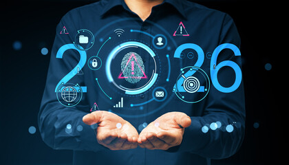 Businessman holding glowing digital icons with fingerprint and futuristic technology symbols representing cybersecurity in 2026 on dark background.