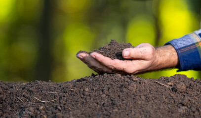 Hands holding soil. Farmers hands full of soil. Hands pouring soil and Hands testing ground.