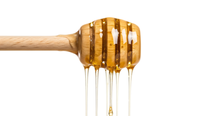 Golden honey dripping from dipper