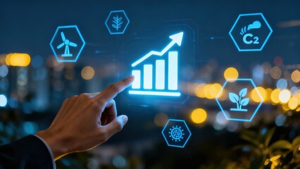 Hand interacting with holographic display showing growth chart and sustainability icons against city night backdrop