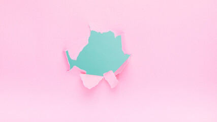 Blurry image of a light green shape on a pink background