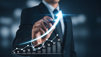 Businessman drawing glowing arrow over bar chart representing sales growth and e-commerce success