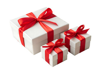A large white gift box next to two smaller ones with bright red ribbons and bows for celebration