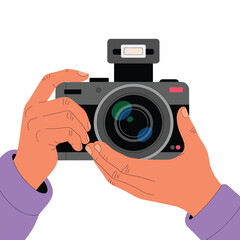 Hands holding a digital camera with flash photography