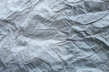 Obraz premium gray crumpled paper texture with clear fold and wrinkle details