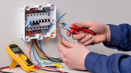 electrician working in electrical panel