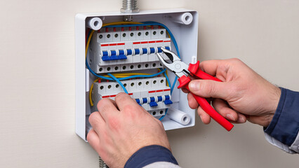 electrician fixing electrical outlet
