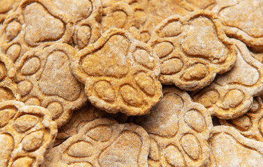 Homemade paw print dog treats close up pile