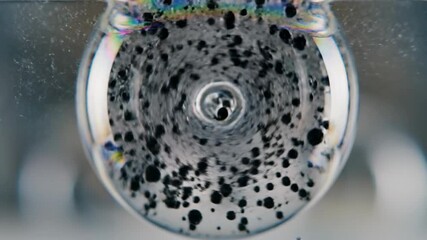 Abstract Black Particles in Water - A Mesmerizing Visual Experiment. - Powered by Adobe