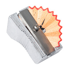 Close up of a metal pencil sharpener with wood shavings, perfect for educational or art-related content