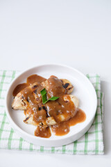 Pisang gapit or pisang epe, grilled banana with palm sugar sauce, Indonesian traditional food.