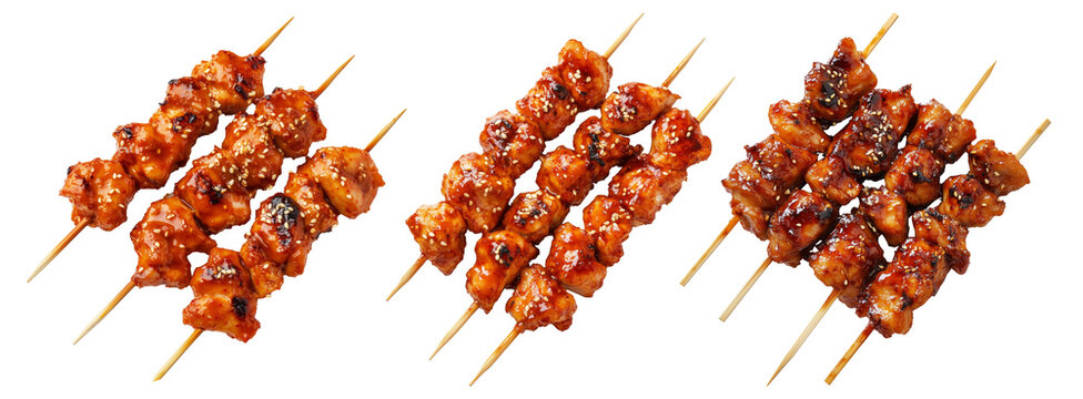 Grilled Korean Dakkochi chicken skewers coated in glossy sesame glaze,isolated on white background, Asian cuisine