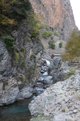 Waterfall rocky landscape. golden autumn.