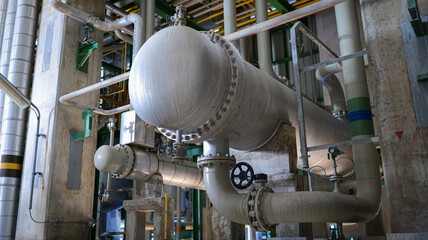 Industrial shell-and-tube heat exchanger within a processing facility,