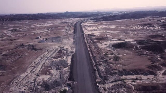 Downward-Moving Drone Shot Revealing Trucks on Makran Coastal Highway, Balochistan, Pakistan
