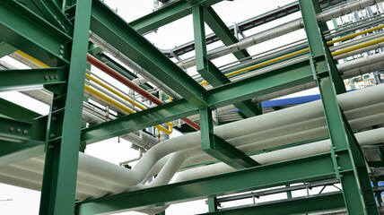 Large industrial pipelines, likely part of a jetty or terminal for transferring oil, gas, or other materials, large industrial pipelines, jetty transfer system, oil and gas loading lines,