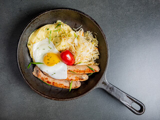 A delightful breakfast spread featuring eggs, sausages, and crisp cabbage ready for enjoying