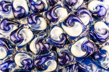 Laundry detergent pods background macro