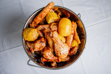 A hearty mix of grilled chicken, sweet corn, and seasoned potatoes brings joy to the table