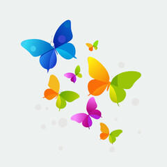 A colorful array of butterflies in flight against a light background © Sanjay