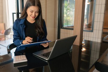 Women are sitting searching for information at office.