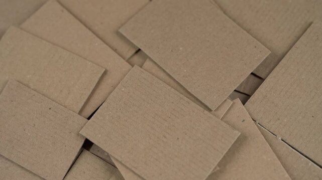 Heap of overlapping brown cardboard pieces. 