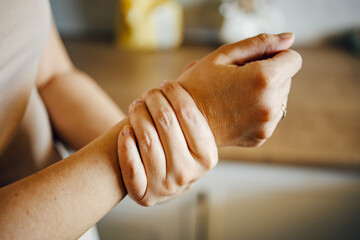 Woman experiencing pain in her wrist joint