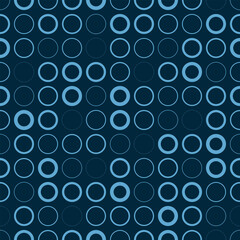 
A seamless pattern of symmetrically arranged light blue circles on a dark blue background. The circles vary in brightness and form an abstract blue pattern. Vector illustration for your projects.