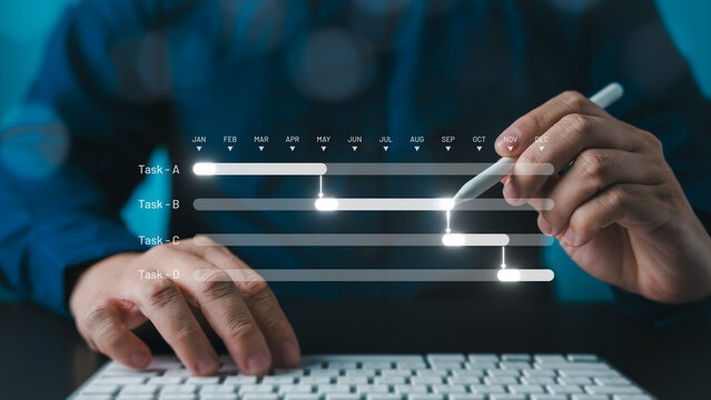 Milestone and progress planning concept for summary reports, showing manager or project engineer managing construction schedules with Gantt charts using software to update and track operational plans.