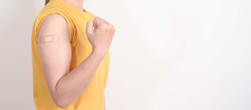 Adult Woman with bandage after received vaccine. Vaccination and Immunization for Influenza, HPV, Zoster, IPD, DTP or Diphtheria, Tetanus and Pertussis, MMR, Hepatitis B, Covid and Varicella vaccine