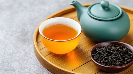 A serene tea set with brewed tea and leaves.