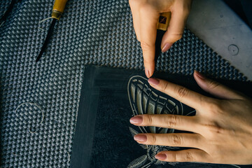 Linocut artist hand curving printmaking hobby