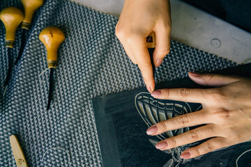 Linocut artist hand curving printmaking hobby