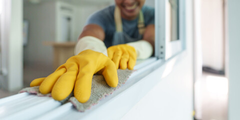 Man using cleaning cloth to wipe surfaces with joy