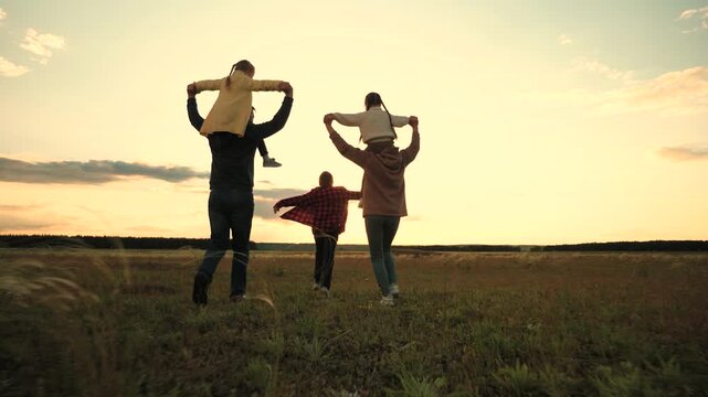 Family adventure, Children playing, Open field walk, Parental love, Weekend vibes, Fresh air fun, Smiling faces, Nature escape, Golden hour, Together forever