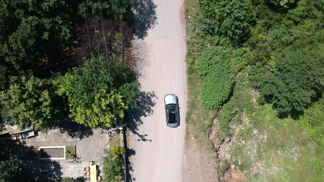 
Car parked in the middle of nature, surrounded by natural scenery. A concept representing travel, freedom, road trips, and exploration in an outdoor environment.