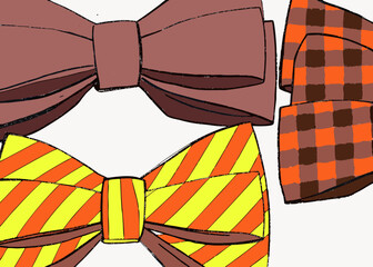 Close-up view of four bow ties with different patterns including solid brown and plaid in orange and brown and stripes in orange and yellow