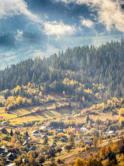 Sunny Autumn Carpathians with Puffy White Clouds