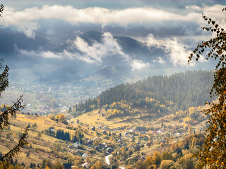 Sunny Autumn Carpathians with Puffy White Clouds