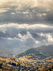 Sunny Autumn Carpathians with Puffy White Clouds