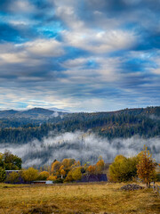 Sunny Autumn Carpathians with Puffy White Clouds