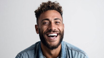Fototapeta premium Happy man with a beard smiles broadly, showing perfect white teeth