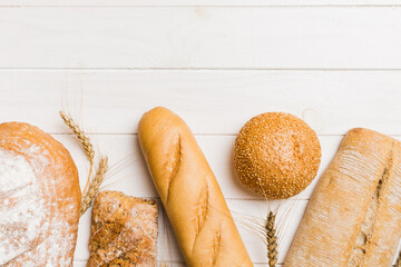 Homemade natural breads. Different kinds of fresh bread as background, top view with copy space