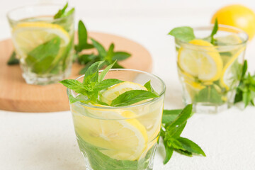 Mojito cocktail. Refreshing mojito cocktail with lime, lemon and mint in a tall glass with a stick